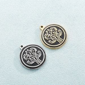 Titanium steel tree of life pendants in gold and silver finish on blue background