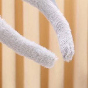 Close-up of soft gray plush headband texture showing fluffy fabric detail for women