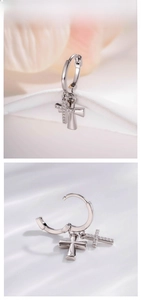 Detailed view of silver hoop earrings with dual cross pendants featuring micro-set zircon