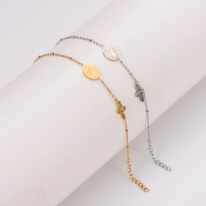 Gold and silver Saint Benedict religious bracelets with oval medals and cross pendants