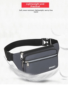 Close-up of lightweight grey waterproof waist bag with multiple zippers and feather