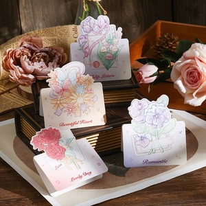 Detail view of retro floral greeting cards with tulips and roses on vintage paper