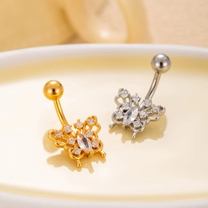 Detail of butterfly belly rings in gold and silver finish with sparkling zircon stones