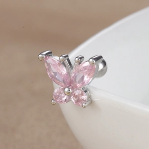 Macro shot of silver butterfly stud earring with pink zircon stones and screw ball back