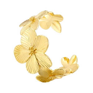 Elegant gold flower cuff bracelet with five-petal layered metal floral pattern