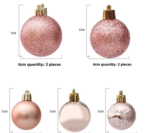Rose gold Christmas ornament set showing various sizes and glitter finishes