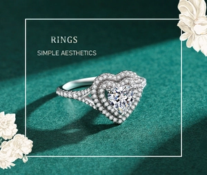 Macro shot of silver heart-shaped diamond ring with pavé stones on green texture