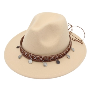 Detail of ethnic silver coins and woven straps on the beige wool fedora hat