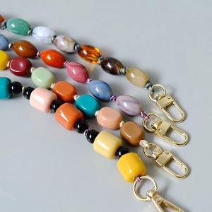 Colorful handmade beaded bag straps and phone chains with golden metal lobster clasps