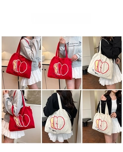 Detail view of canvas tote bag featuring artistic apple print and spacious interior design