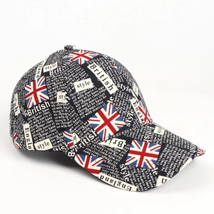 Detail of baseball cap featuring British flag patterns and newspaper style graffiti print