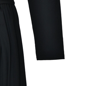 Close-up of black round neck jumpsuit showing high-quality fabric texture and sleeve seam detail