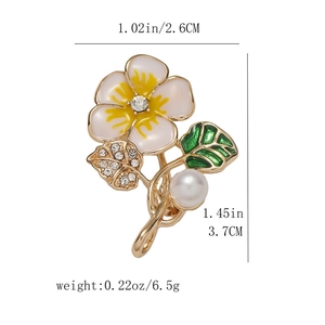 Detailed view of floral brooch with dimensions 3.7cm height and 2.6cm width