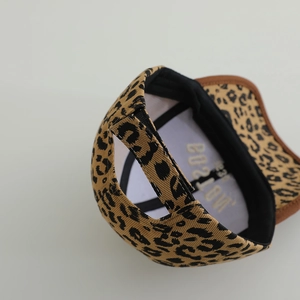 Detailed back view of a kids leopard print baseball cap with adjustable strap