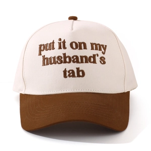 Detail of cotton baseball cap featuring high-quality embroidery text on the crown