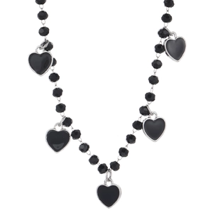 Detail of gothic beaded necklace with black heart pendants and silver metal borders