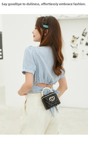 Detailed view of mini silicone bucket bag with pearl handle and metal chain strap