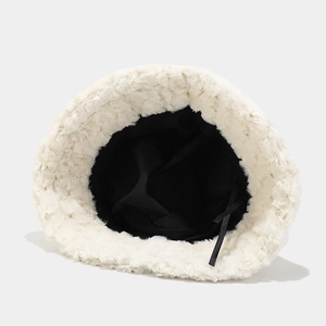 Detail of soft white plush bucket hat with adjustable inner drawstring and black lining