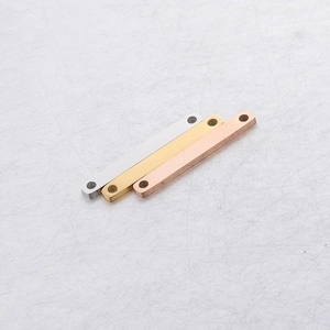 Macro view of rectangular stainless steel connectors in silver, gold, and rose gold finishes