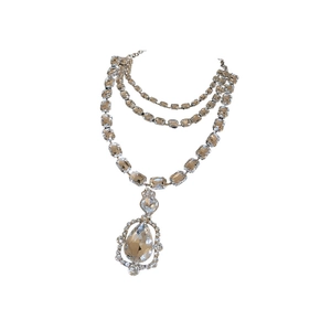 Multilayer silver necklace with sparkling rectangular crystals and large pear pendant