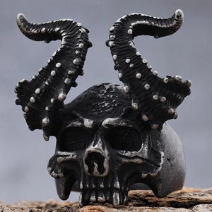 Gothic punk ram skull ring for men with vintage silver finish on dark wood texture