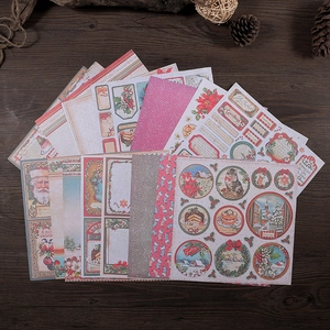 Classic pink Christmas scrapbook paper set with vintage Santa Claus and winter motifs