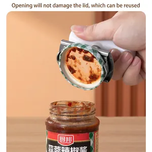 Multifunctional stainless steel jar opener opening a glass jar lid without damage