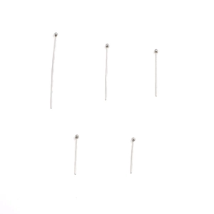 Macro detail of 0.6mm silver stainless steel ball head pins for jewelry making