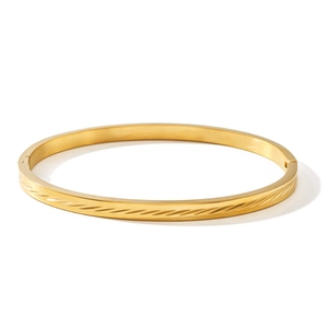 Minimalist gold stainless steel open bangle with diagonal textured facets and high polish