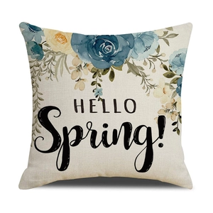 Osterkissenbezug aus Leinen mit blauen Blumenmustern und HELLO Spring Text auf weißem Grund