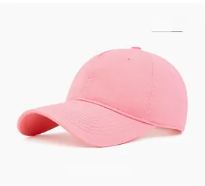 Close-up of pink cotton twill baseball cap with classic six-panel design and curved brim
