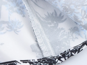 Detailed close-up showing fine stitching and cotton linen fabric texture with palm prints