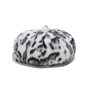 Detailed view of plush faux fur texture on a leopard print beret for winter