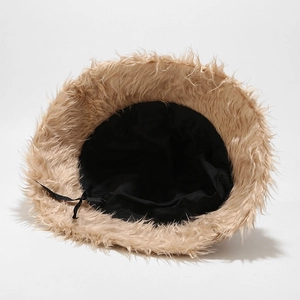 Plush beige bucket hat with soft faux fur exterior and adjustable black inner drawstring