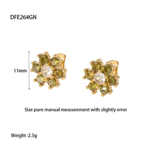 Detail view of 11mm flower stud earrings with olive green stones and gold finish