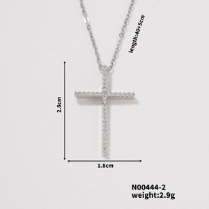 Detail view of silver cross necklace showing dimensions 2.8cm by 1.8cm and 40+5cm chain length