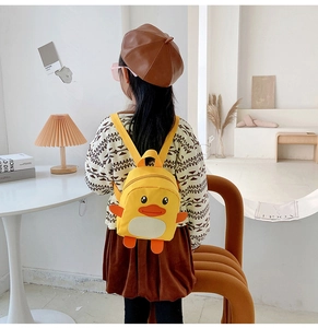 Detailed view of yellow duckling toddler backpack with adjustable straps and orange accents