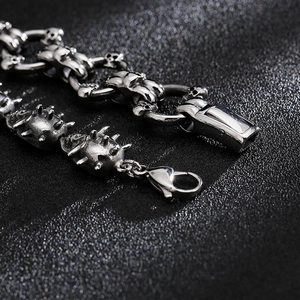 Close-up of gothic punk skull bracelet with silver spikes and lobster clasp closure