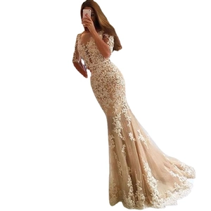 Elegant champagne lace mermaid evening gown with mid-sleeves and floral crochet pattern