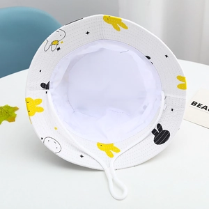 Detail of white cotton kids bucket hat with yellow rabbit print and adjustable chin strap