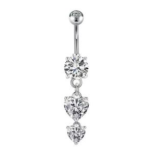 Detailed view of silver belly ring with sparkling zircon heart-shaped pendants on white