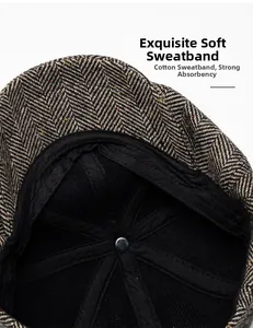 Detail view of newsboy cap featuring soft cotton sweatband and herringbone wool texture