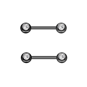 Detail of black barbell body jewelry featuring clear faceted crystals and smooth finish
