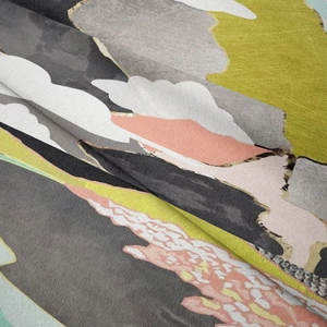 Macro detail of abstract geometric wall tapestry showing soft textured fabric folds