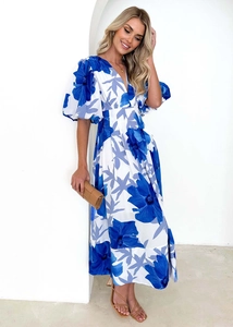 Detailed close-up of V-neckline and puff sleeve design on floral print maxi dress