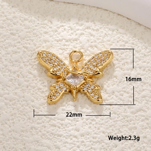 Detail view of gold butterfly pendant with crystals and dimensions 16mm x 22mm