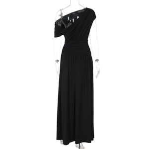 Detailed close-up of black one-shoulder maxi dress with elegant waist pleats and drapes