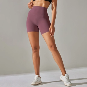 Detailed close-up of high-waisted purple yoga shorts showing the premium matte texture