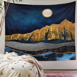 Detail of modern abstract mountain tapestry with golden peaks and moon in a cozy bedroom