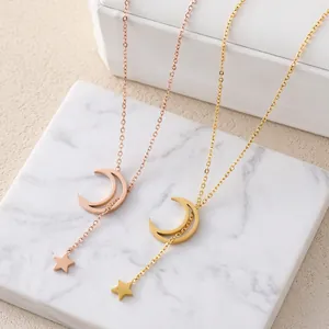 Elegant gold and rose gold star and moon pendant necklaces on premium display case